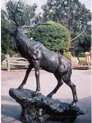 Bronze Elk standing on a Rock