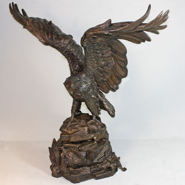 Bronze Eagle Landing on a Rock