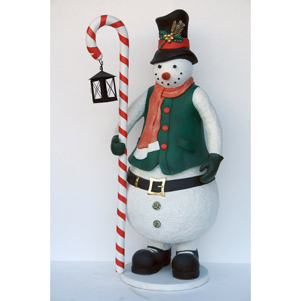 Snowman with candle stick and lantern